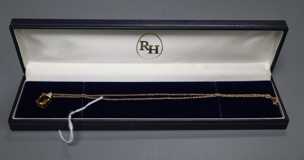 A citrine and diamond rectangular pendant on 9ct gold fine chain, chain 38mm, pendant 15mm, gross 2.6 grams.